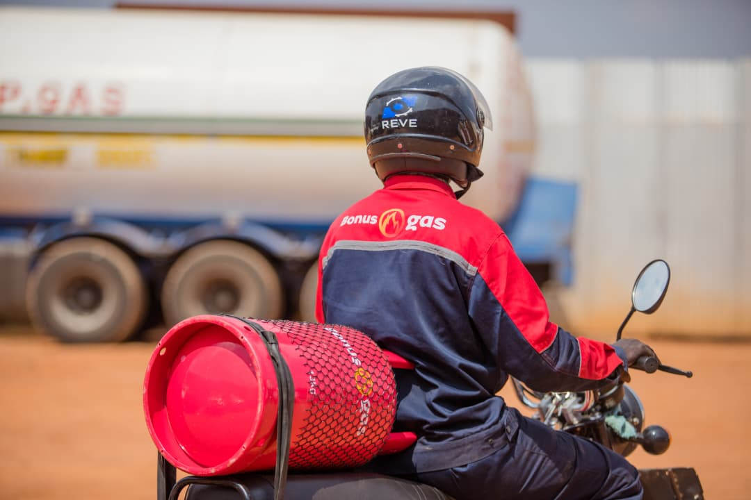 Helmeted Bonus Gas delivery rider viewed from behind